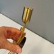 A set of "tulip" wall lamps in golden colored metal. Danish 1970-80s
