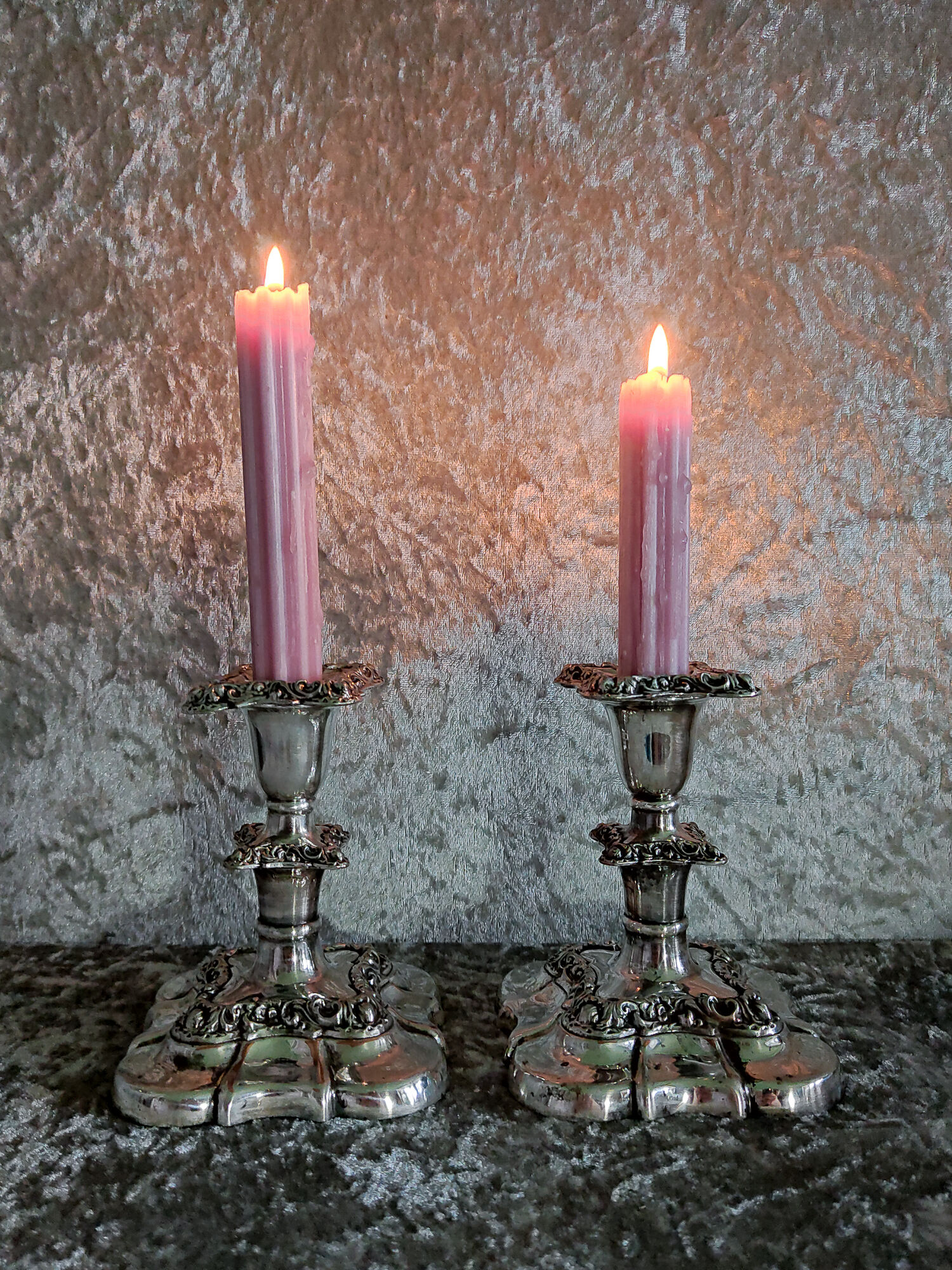 Pair of silver metal candle holders
