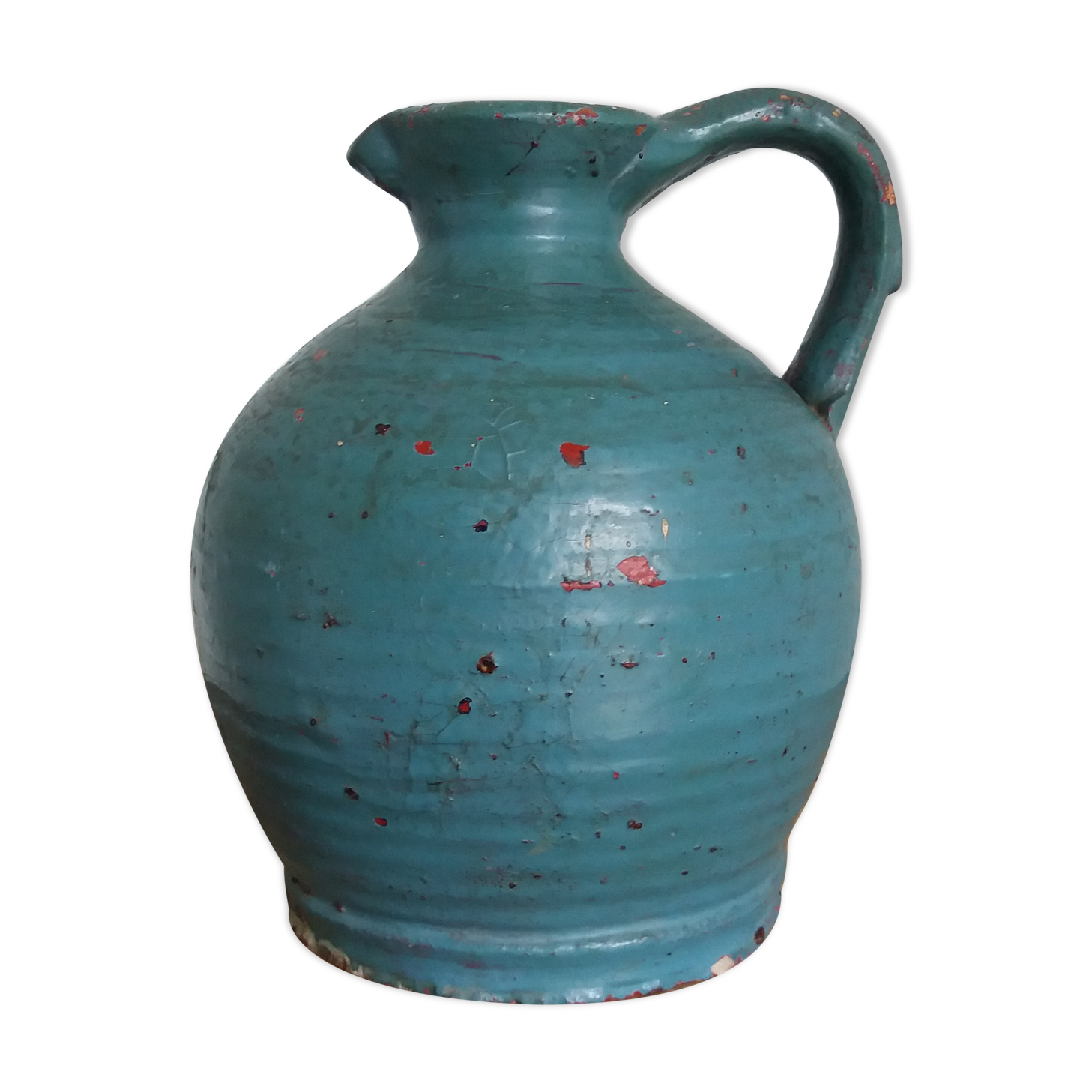Sandstone pitcher painted in turquoise, very old pottery