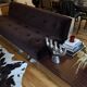 Red Edition Stanley 3-seater sofa with matching chocolate velvet storage.