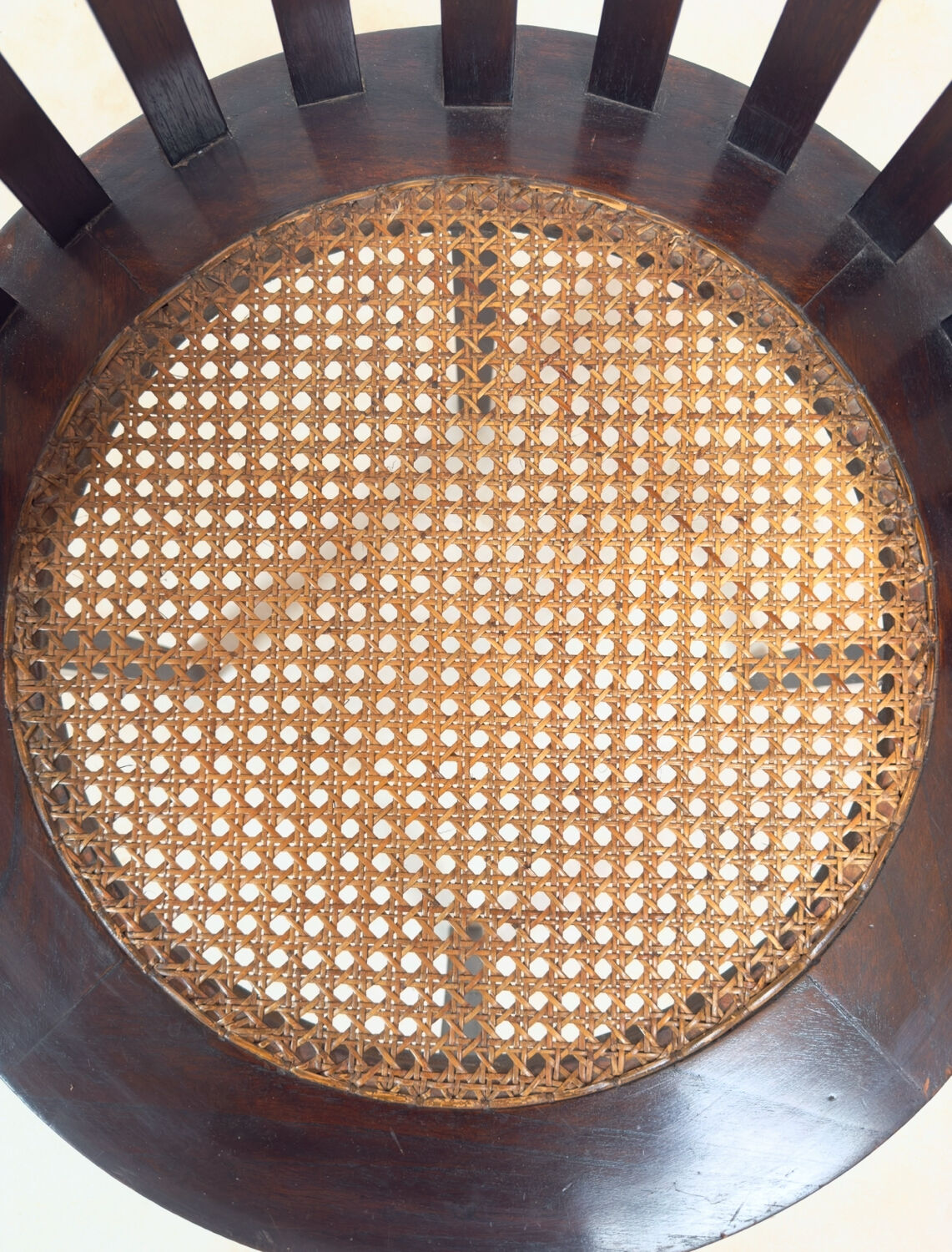 Colonial "Art Deco" armchair in wood and cane.