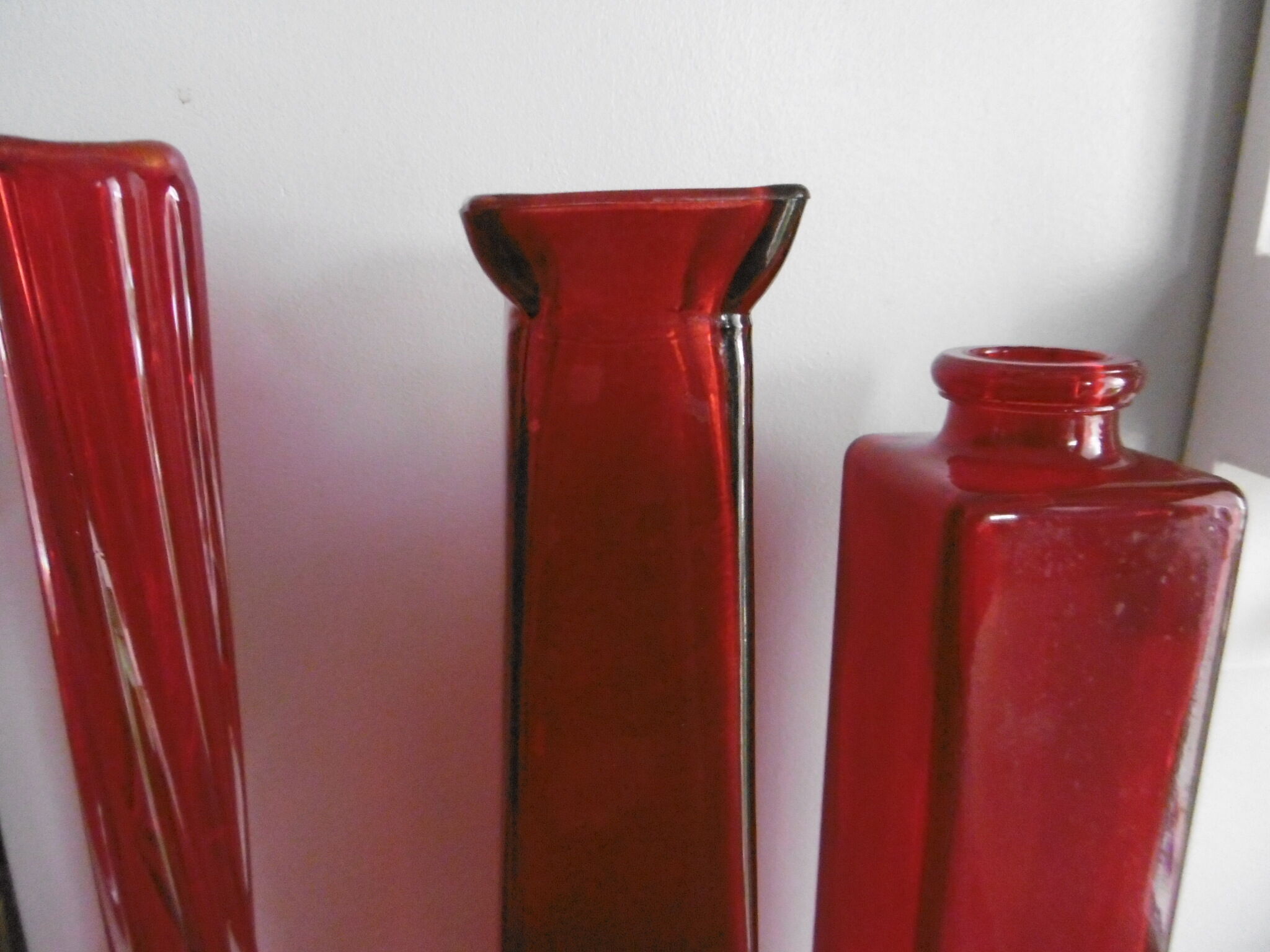 Set of three red bottles