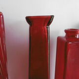 Set of three red bottles