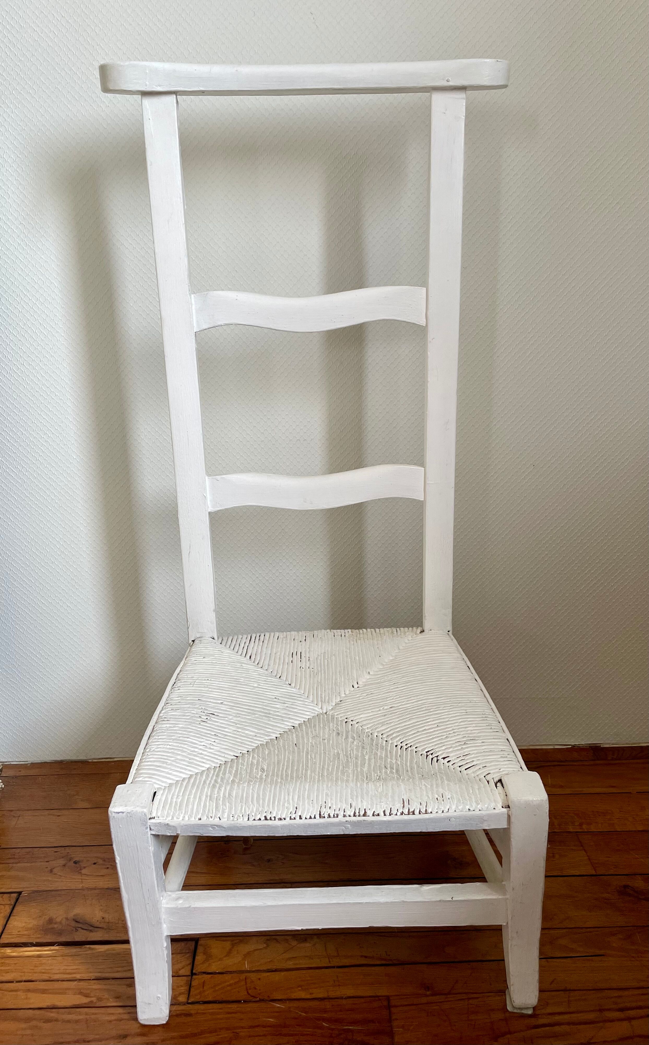 Old white mulched wooden chair