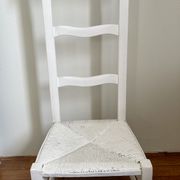 Old white mulched wooden chair