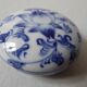 Porcelain pill box decorated with blue and white flowers
