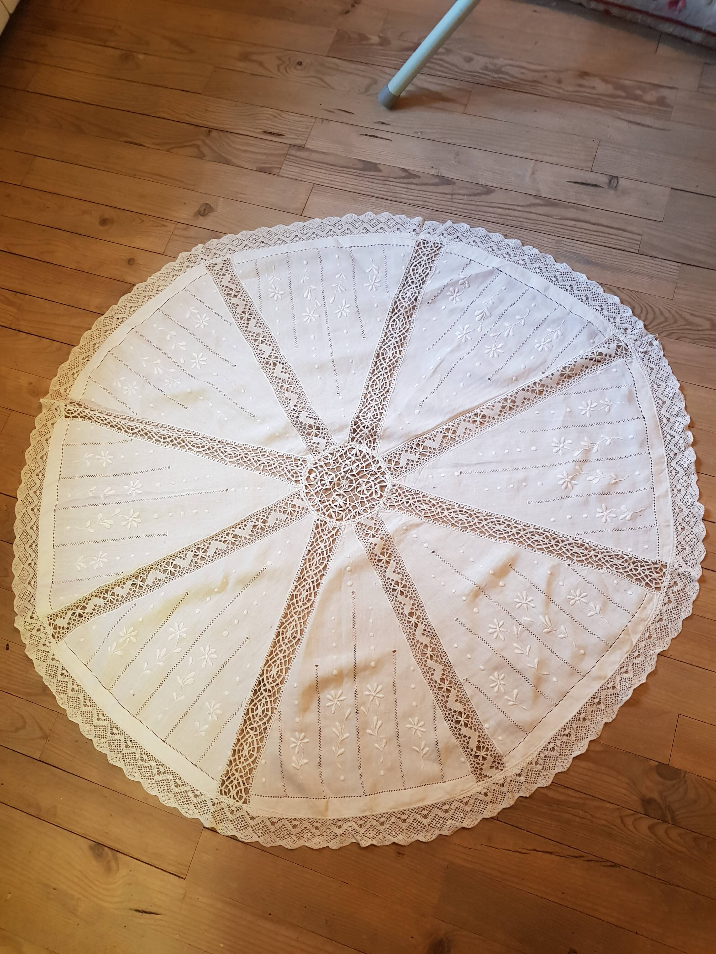 Round hand-embroidered linen tablecloth
