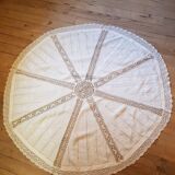 Round hand-embroidered linen tablecloth