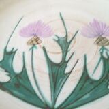 Round dish with thistles