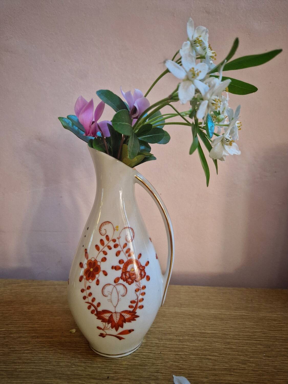 Hand painted German porcelain pitcher with floral design and gold trim