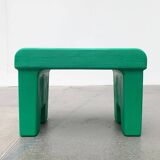 Postmodern plastic stool with a wood effect.