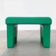 Postmodern plastic stool with a wood effect.