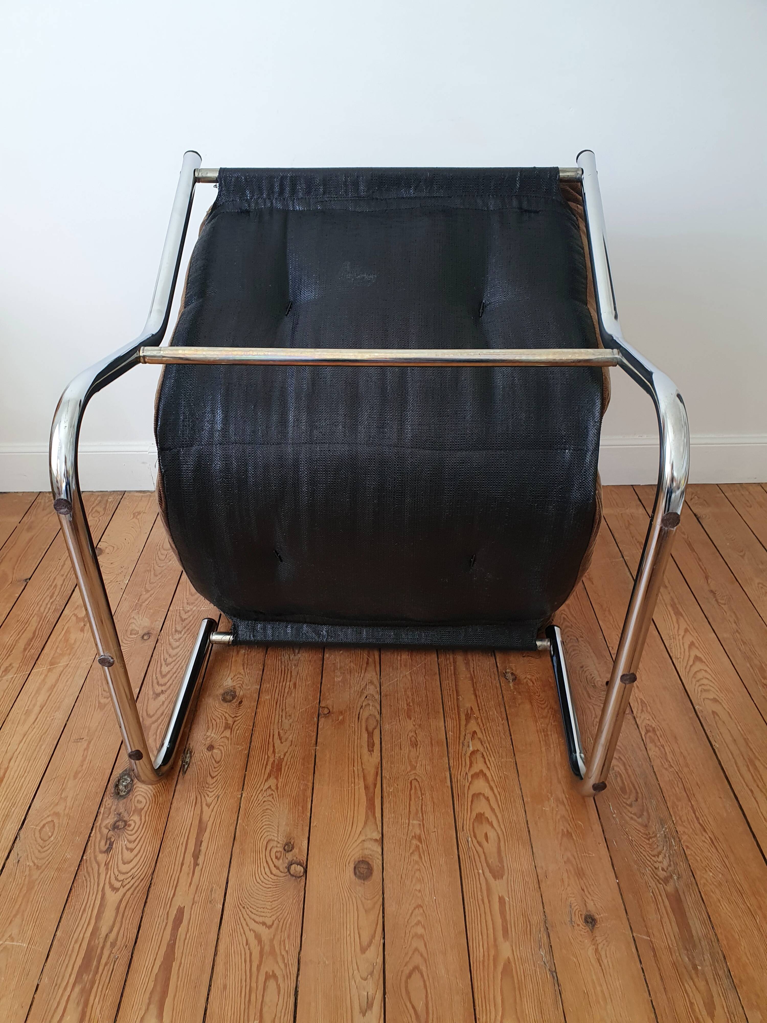 Vintage tubular chrome and velvet armchair