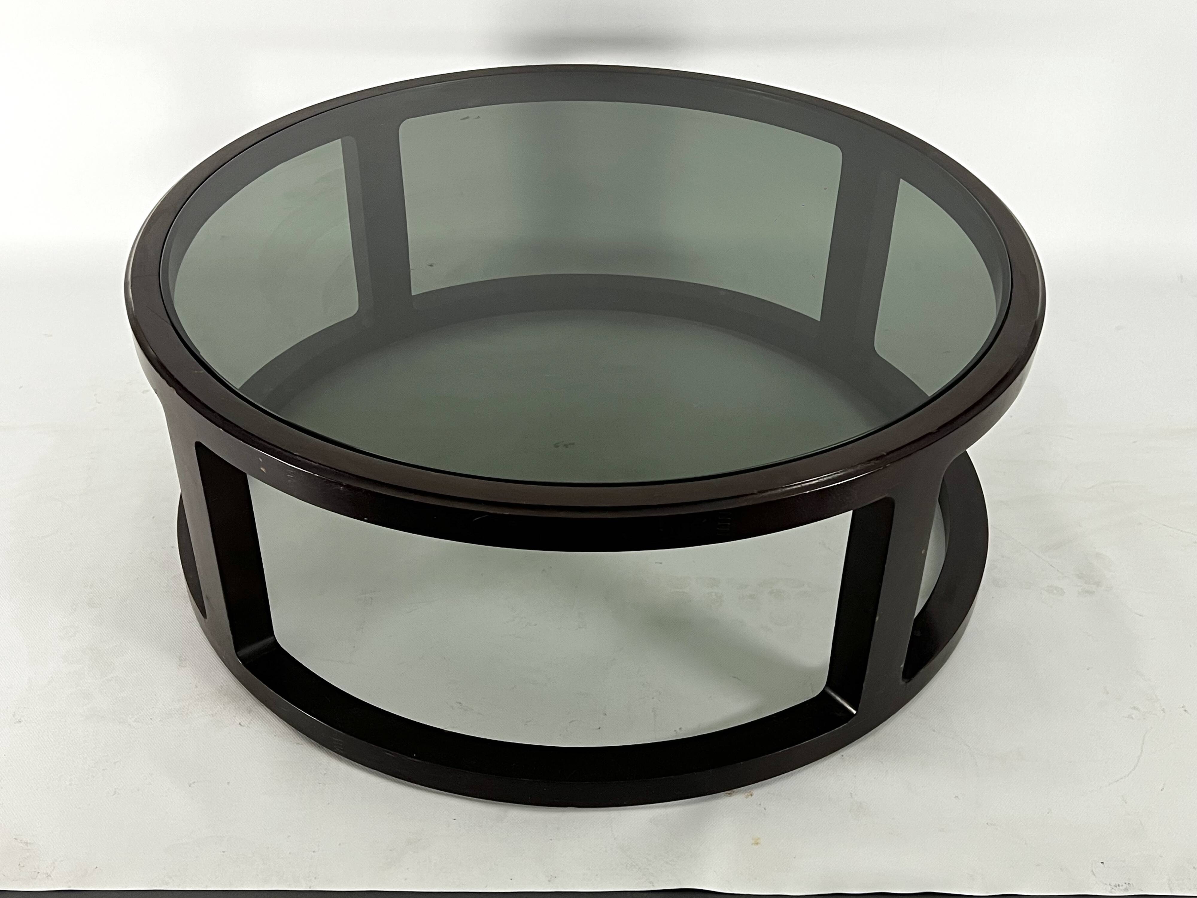 Italian Vintage Large Round coffee table in wood and fume glass. 1970s