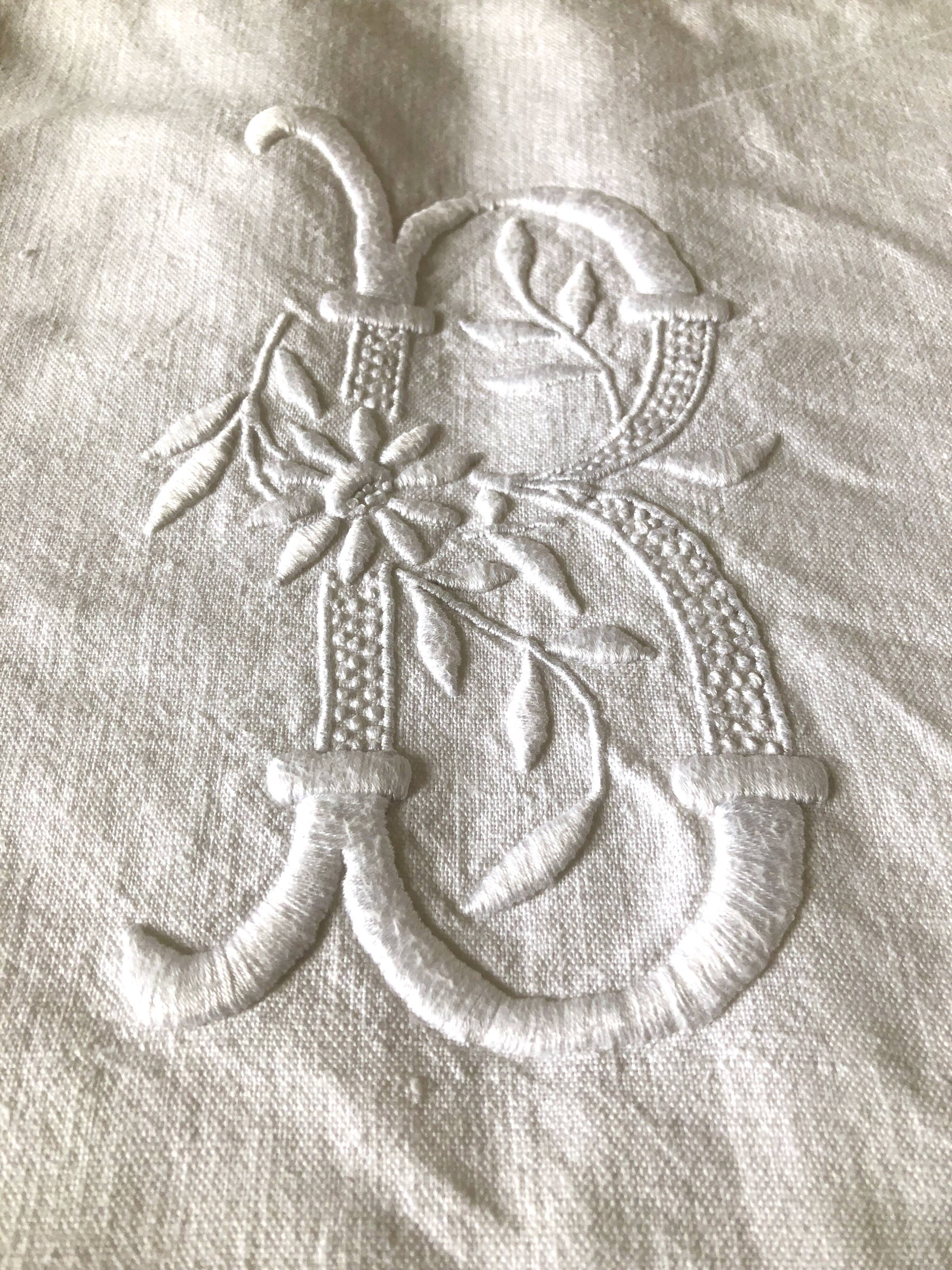 Old embroidered cloth, monograms and lace