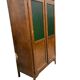 Vintage wooden display cabinet with green glass.
