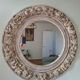 Round mirror with floral patterns