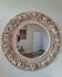 Round mirror with floral patterns