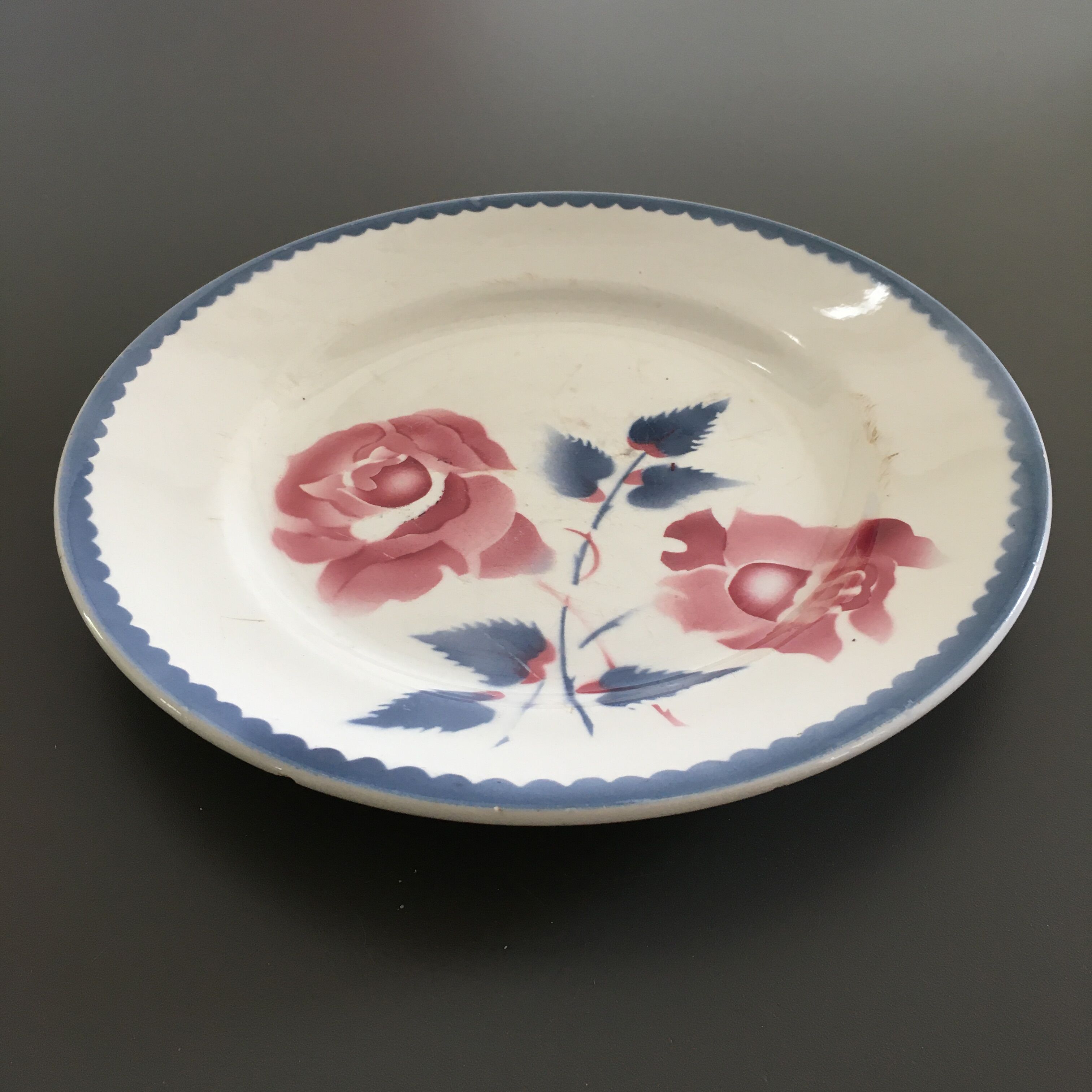 Antique plate decorated with roses