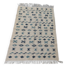 Handmade white and blue carpet in natural wool