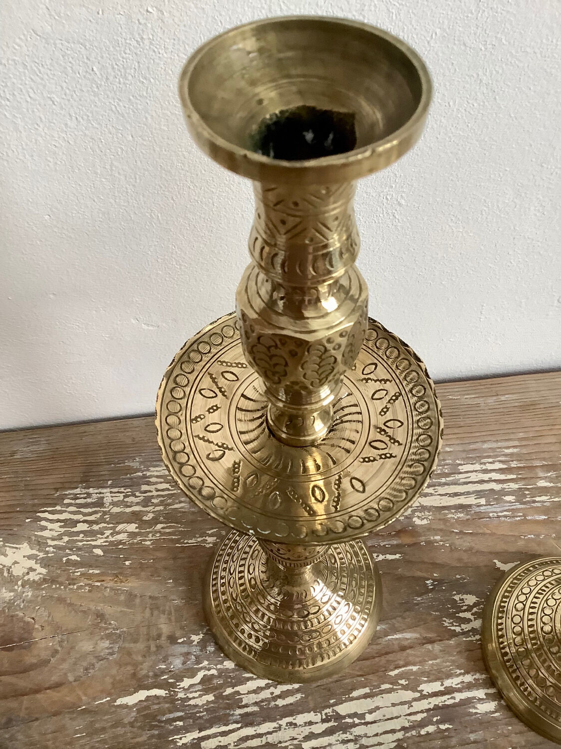 Pair of engraved brass candle holders