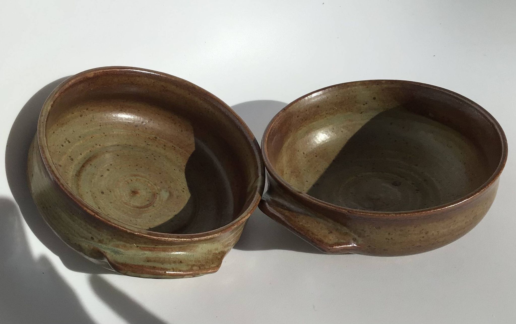 2 Handcrafted green-brown stoneware bowls signed