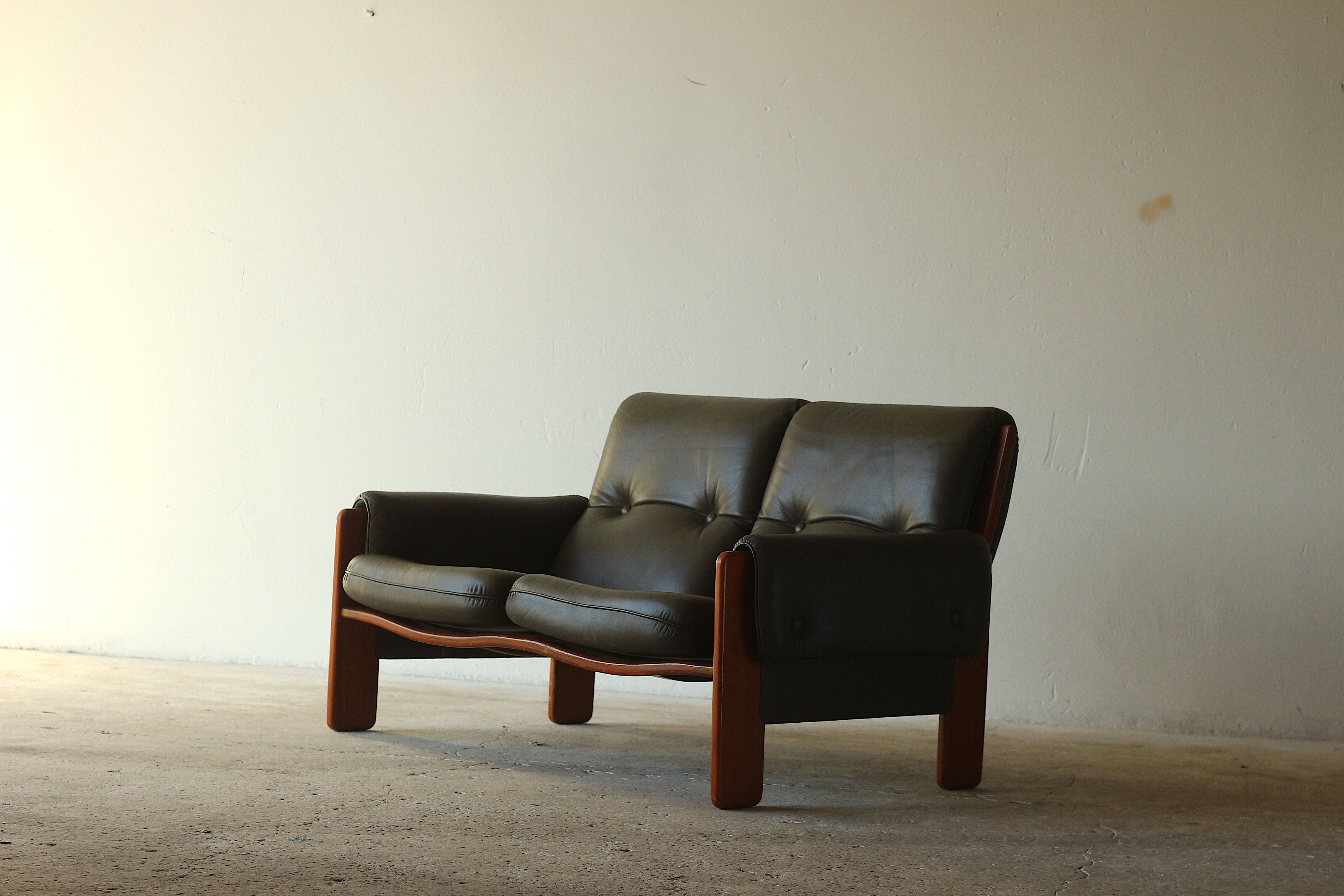 Olive leather two seater sofa, 1970'