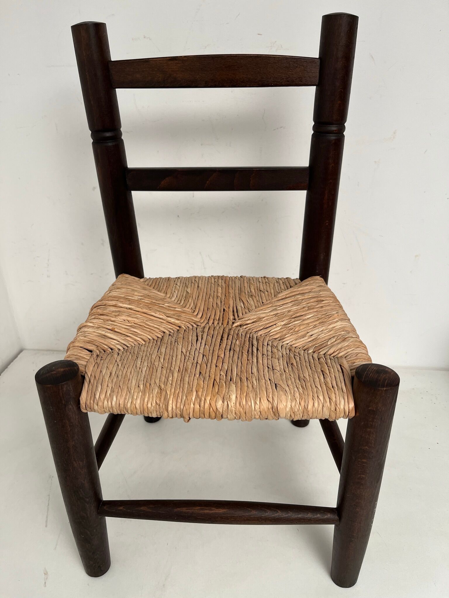 Wooden children's chair with vintage straw seat
