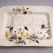 Very large rectangular dish with scalloped edges, made of fine glazed earthenware.