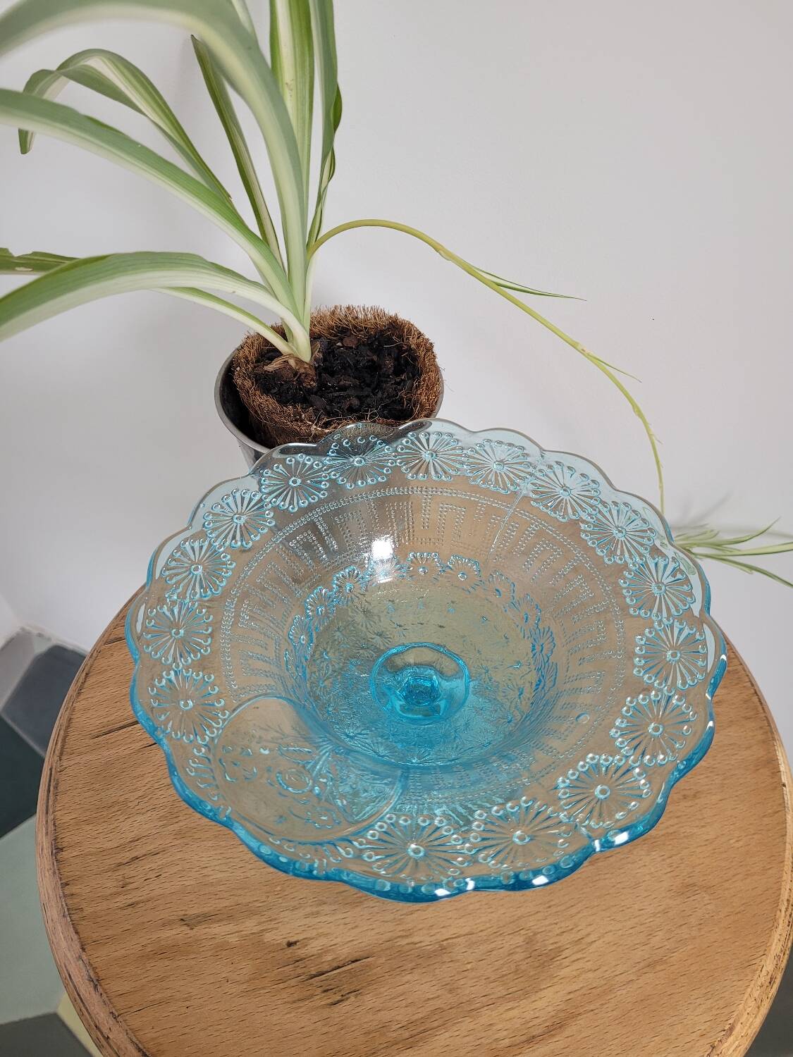 Plate on blue glass pedestal