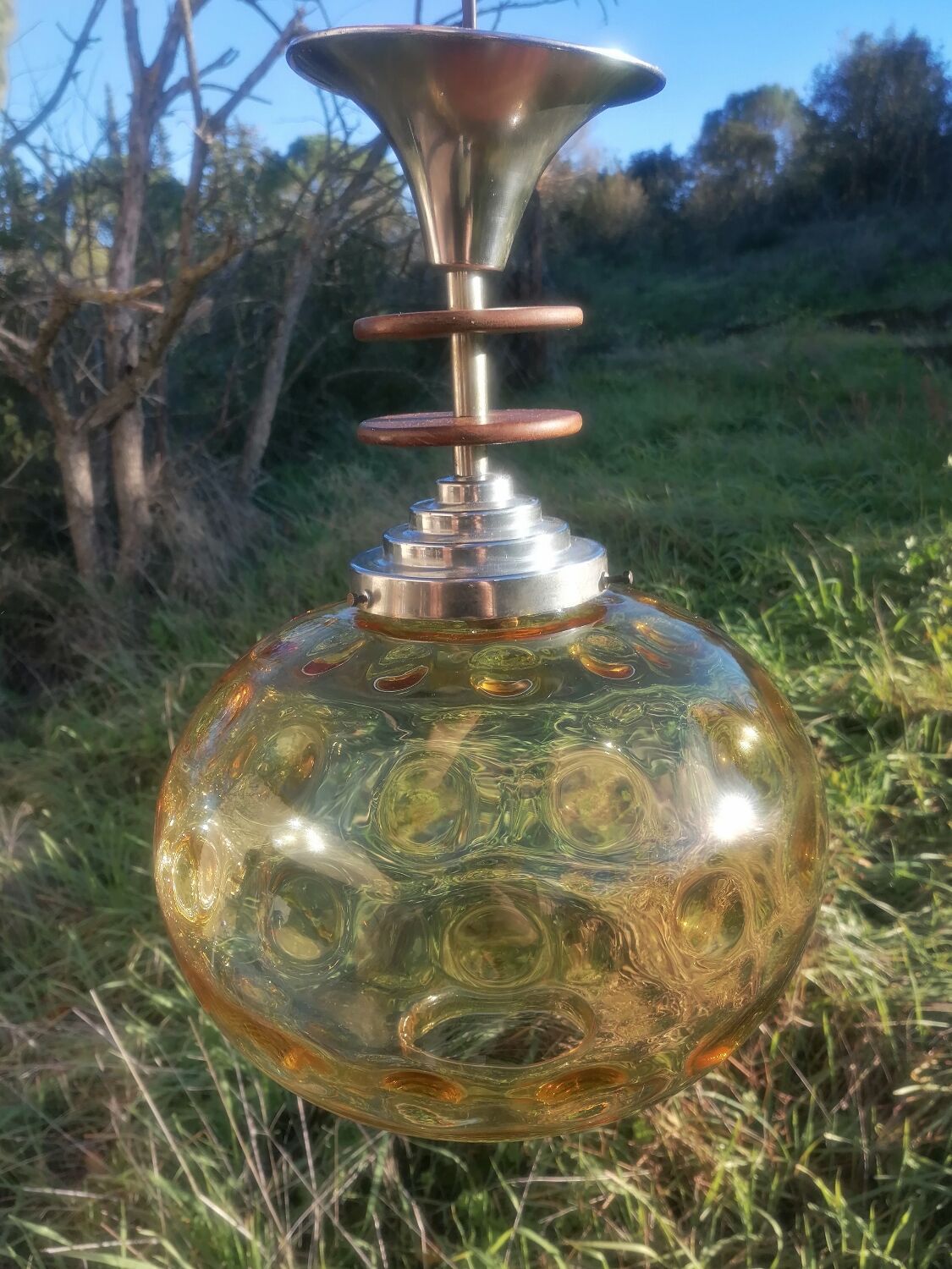 Vintage suspension ball in amber glass