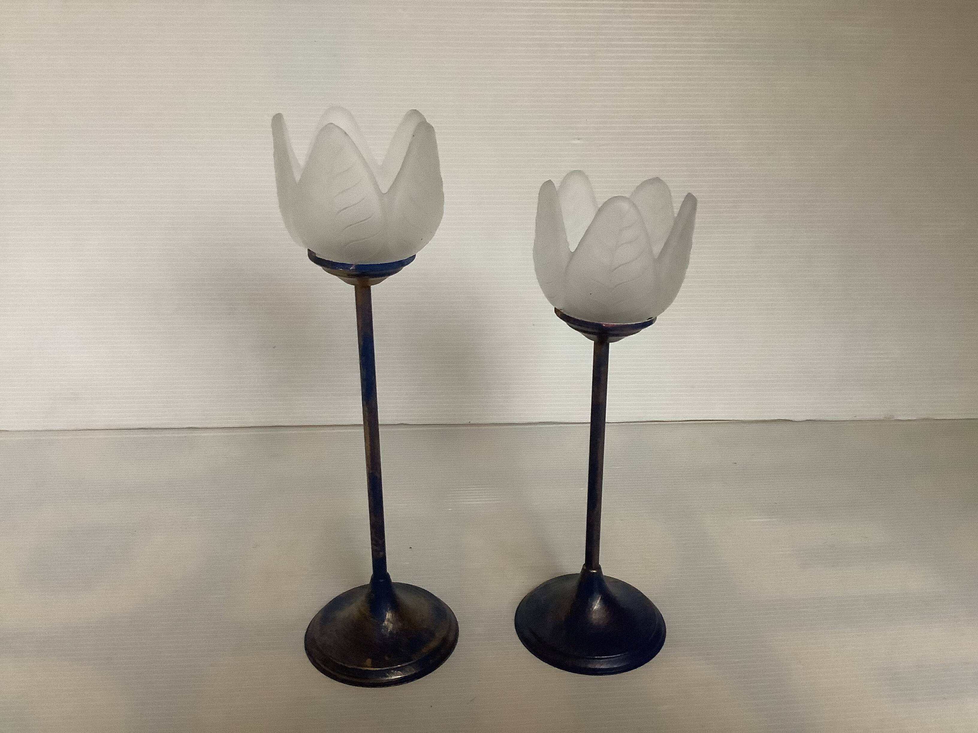 Pair of glass and metal flower candlesticks