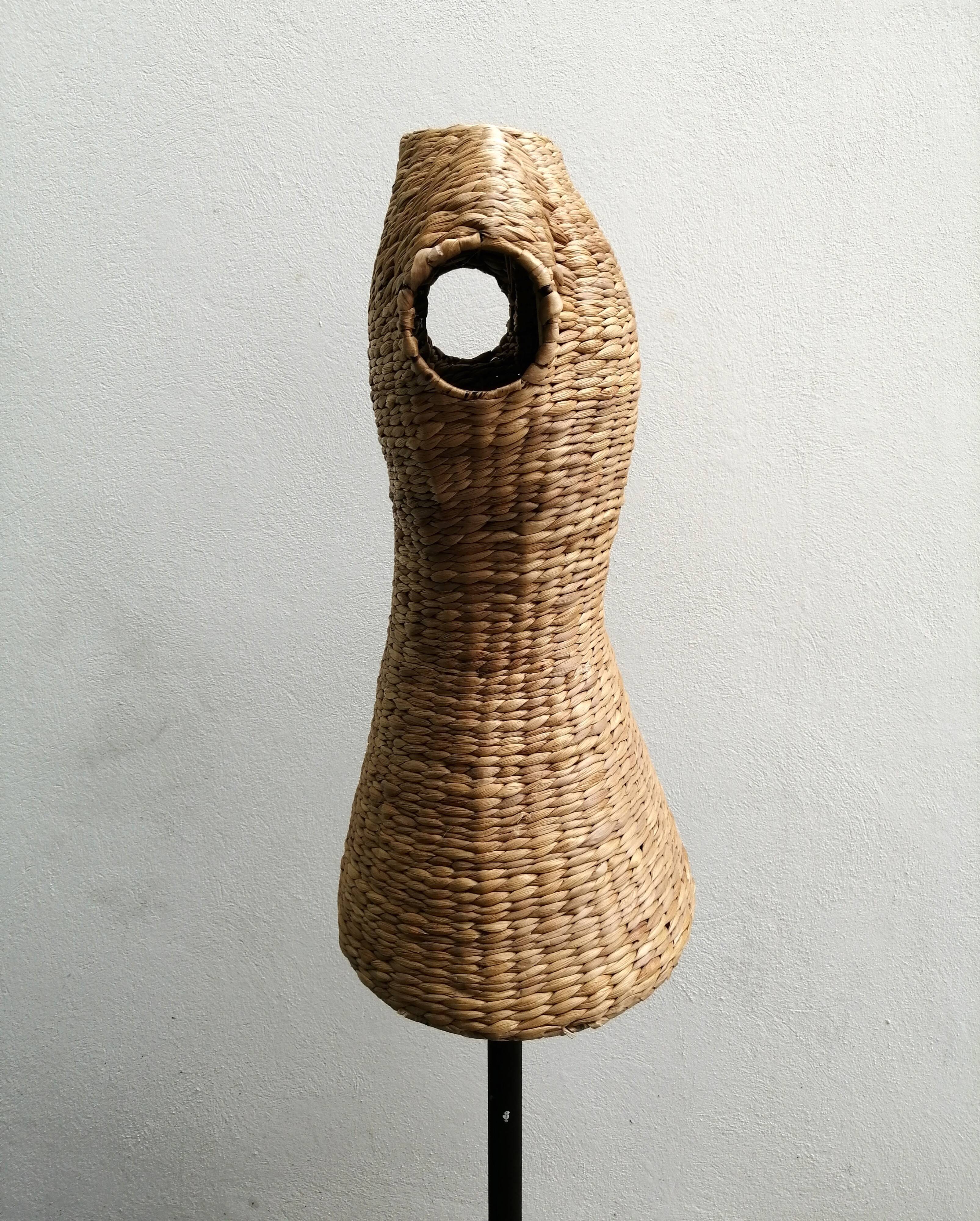 Model on a wicker stand.