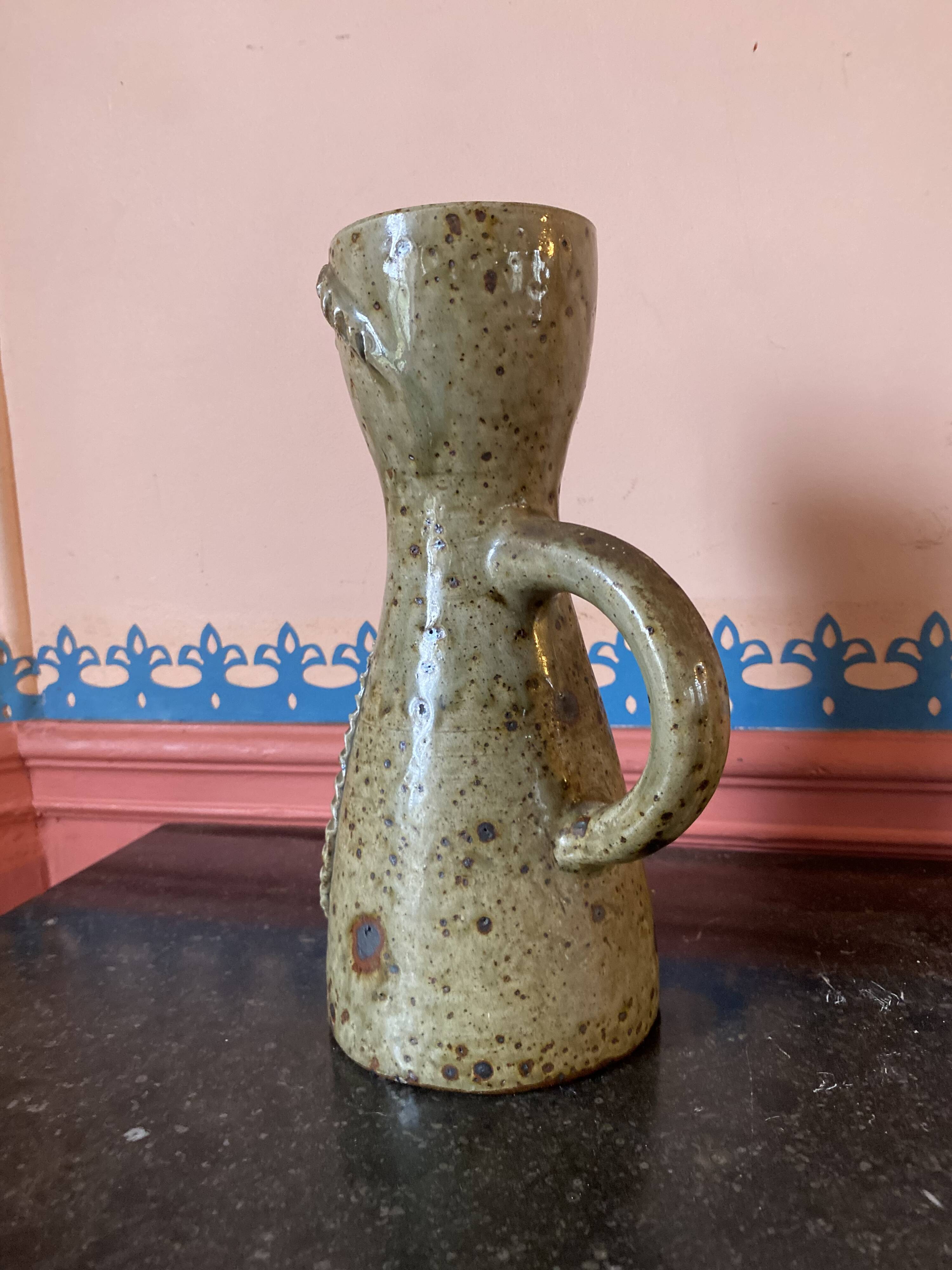 Anthropomorphic stoneware pitcher signed Jean Lerat