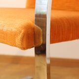 Chrome-plated metal and orange fabric armchair, 1970