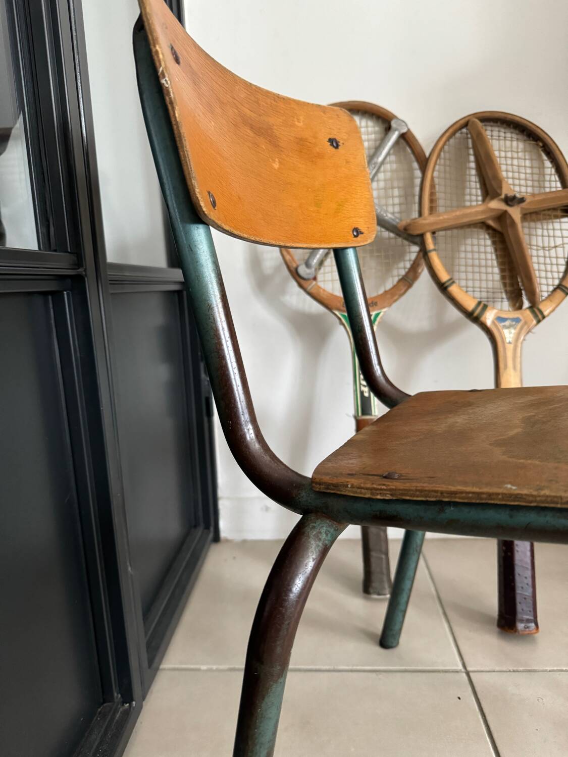 Old wooden and metal children's school chair