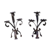 Deux chandeliers en fer forgé