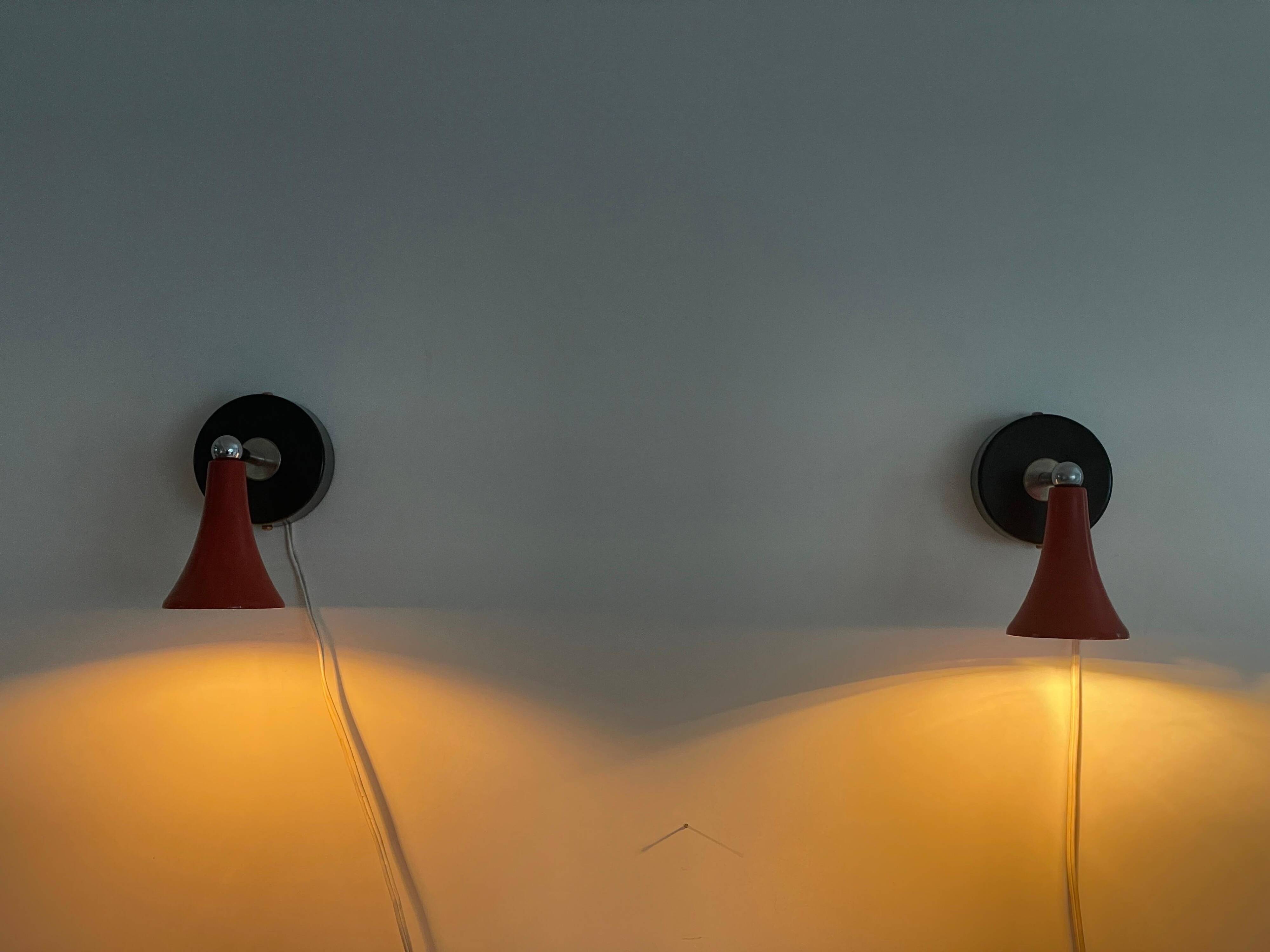 Pair of red metal wall lights AGE, 1970s, Italy