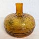 Bouteille en verre ambré texturé forme orange