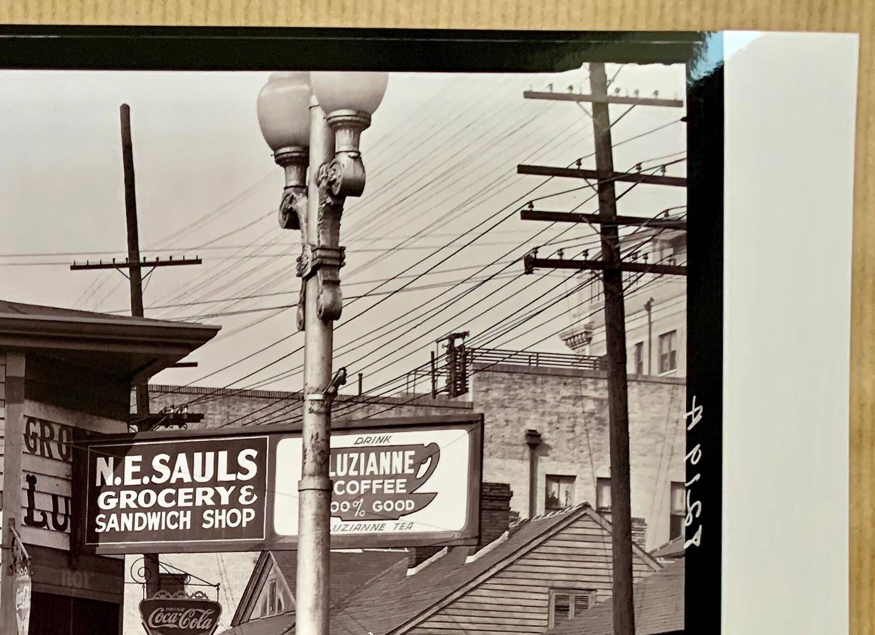 "Street corner in New Orleans, front of the NE Saul' sandwich shop