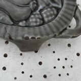 Art Deco period grey enamelled cast iron trivet