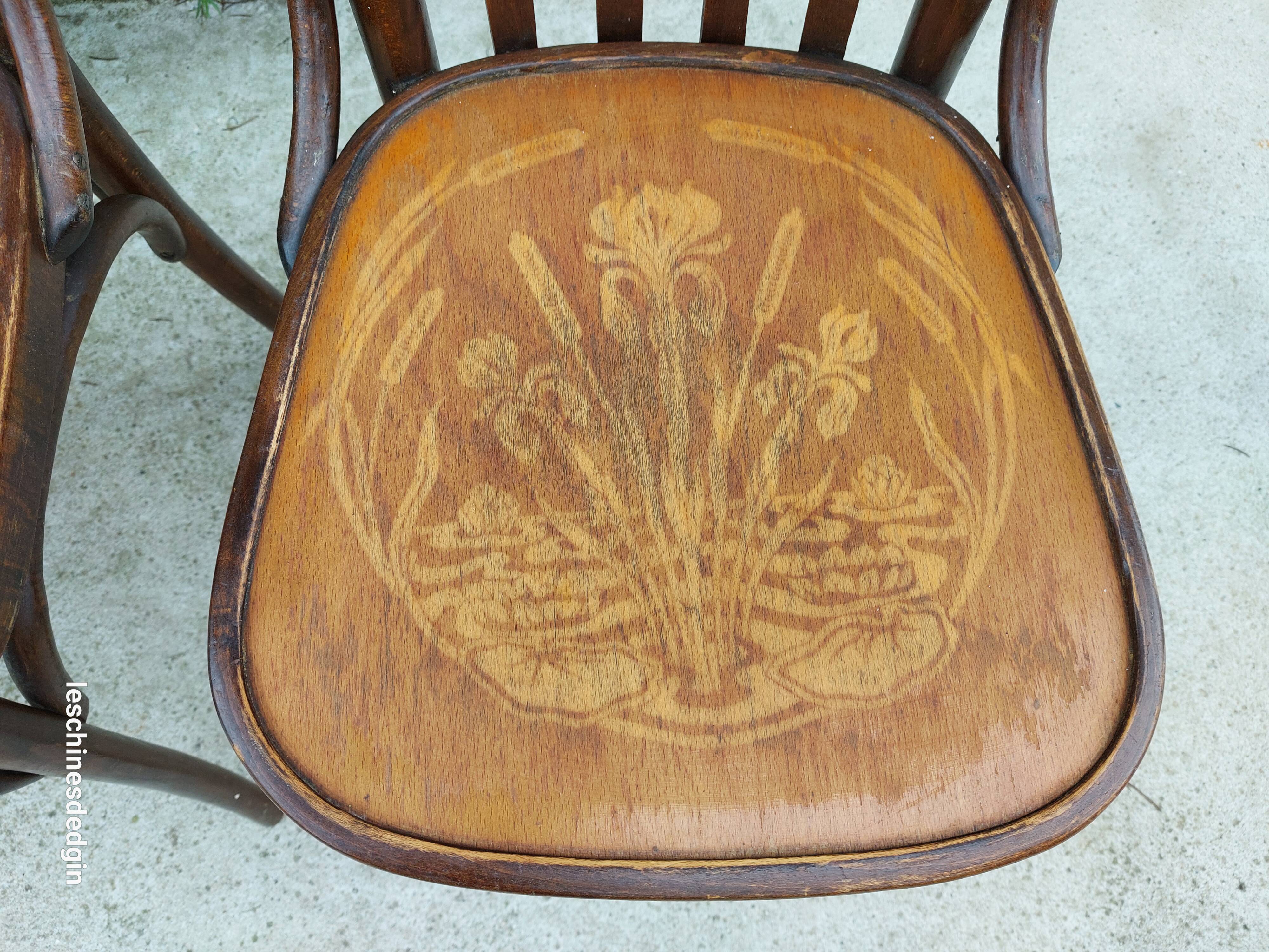 4 bentwood bistro chairs with a pattern on the seat