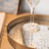 Patinated mirrored top and brass