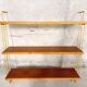 Vintage wall shelf in teak and golden brass String Tomado style