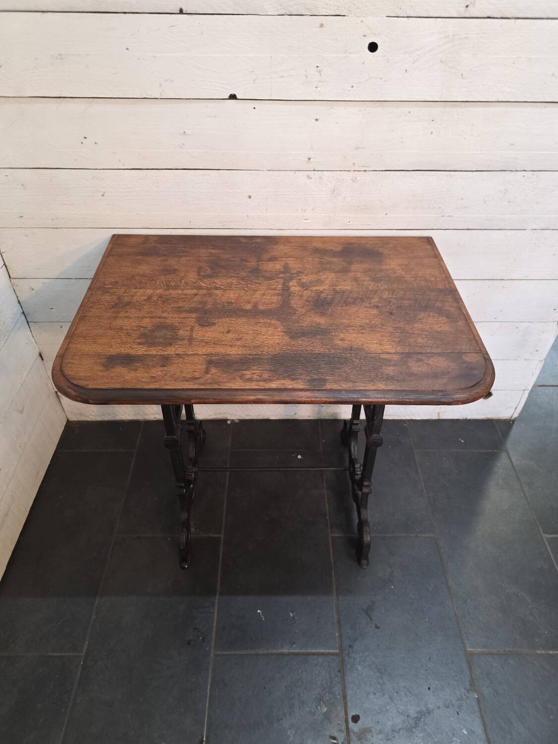 Bistro table with cast iron legs and oak top