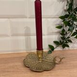 Brass candle holder on frame
