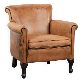 Beautiful subtle vintage sheepskin armchair with elegant legs