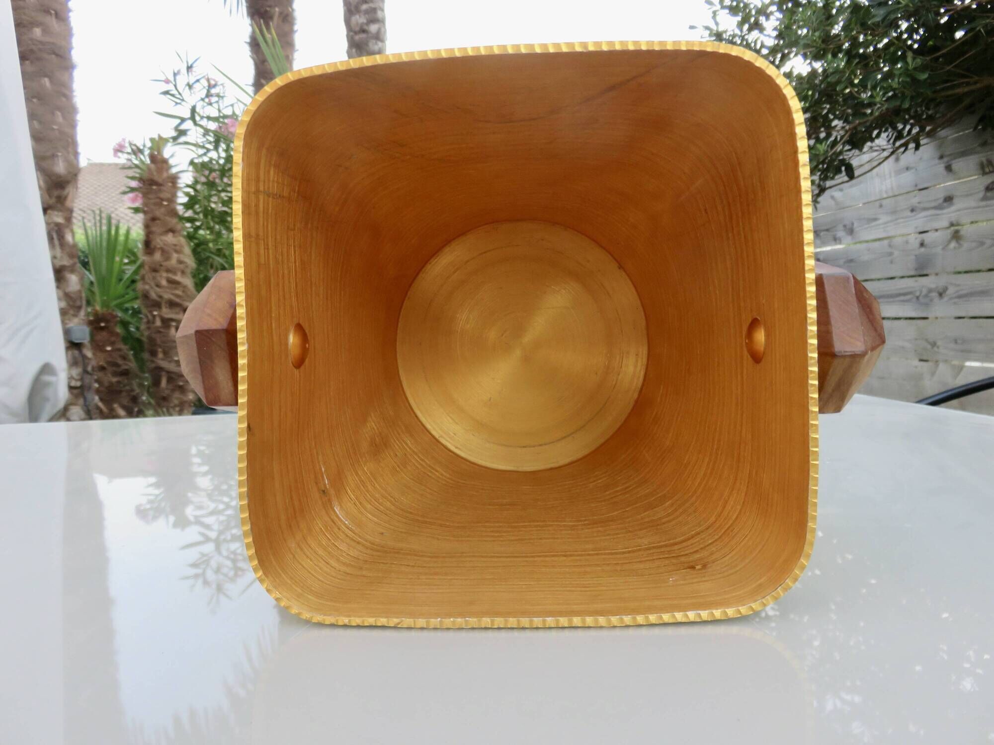 Gold anodised aluminium ice bucket, teak handles, signed T.L PARIS.