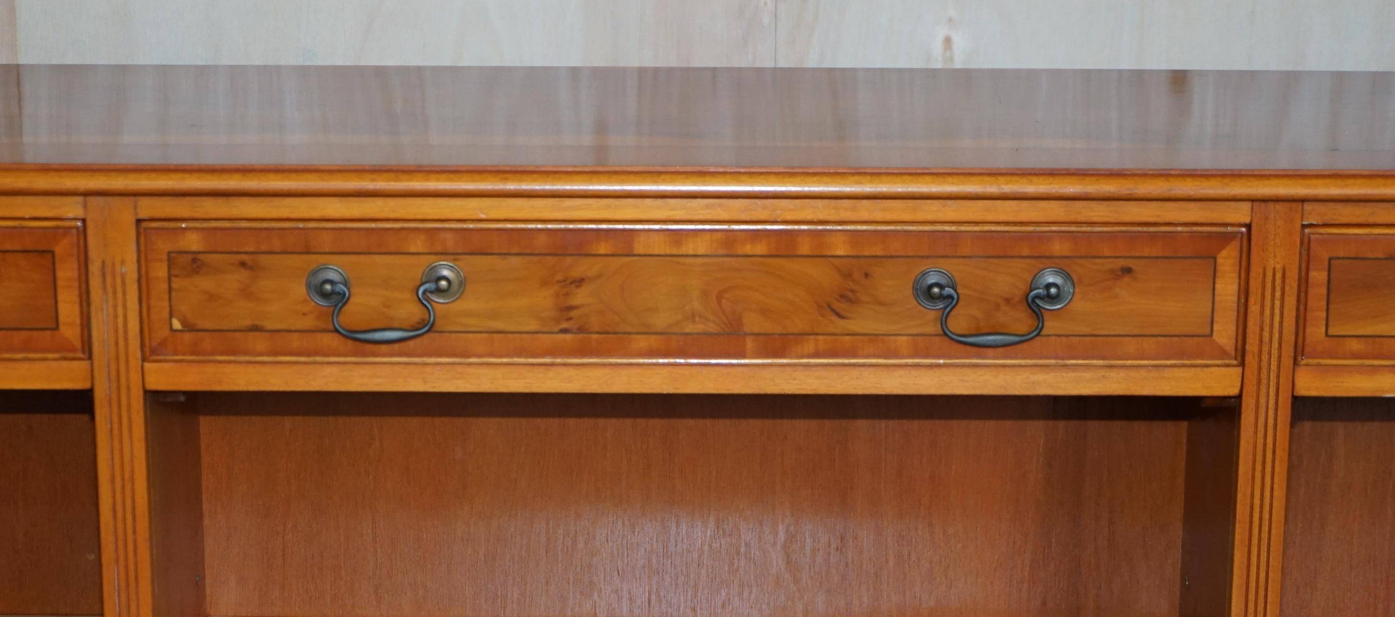 Vintage yew wood library/buffet with three drawers.