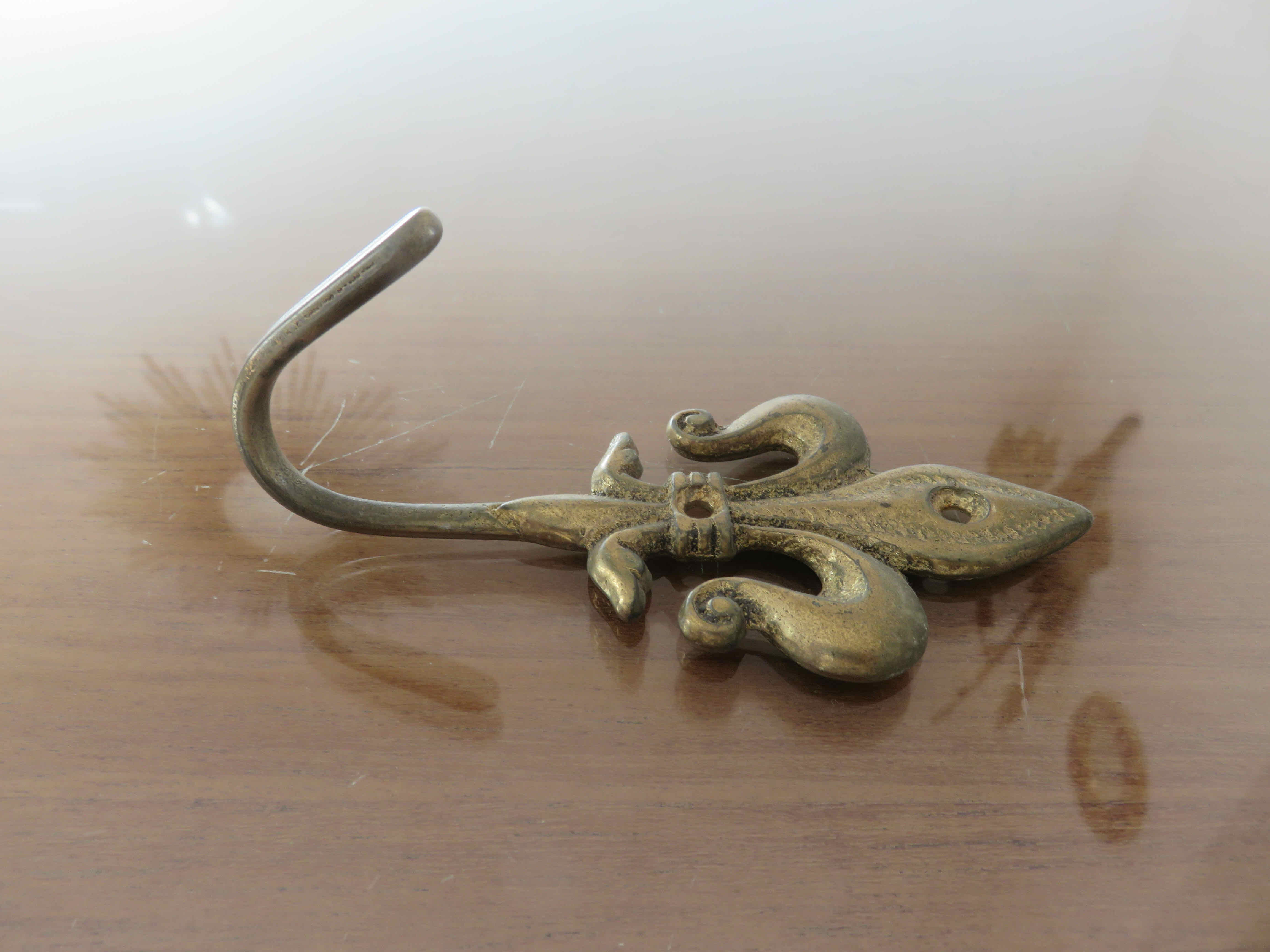 Brass "fleur de lys" hook 30-40s